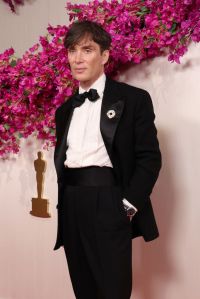 Cillian Murphy attends the 96th Annual Academy Awards wearing a black suit and bowtie.