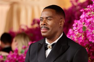 Colman Domingo attends the 96th Annual Academy Awards smiling facing left wearing a black suit and bowtie as part of our Most Dapper Men At The 2024 Oscars list.