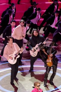 (L-R) Mark Ronson, Wolfgang Van Halen, Ryan Gosling, and Slash perform 'I'm Just Ken' from "Barbie" onstage during the 96th Annual Academy Awards at Dolby Theatre on March 10, 2024 in Hollywood, California.