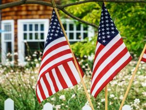 Small town USA photo with American flags. This story is on the wealthiest small towns in America.