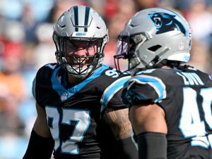 Yetur Gross-Matos #97 and Frankie Luvu #49 of the Carolina Panthers celebrate after a sack during the first quarter against the Tampa Bay Buccaneers at Bank of America Stadium on January 07, 2024 in Charlotte, North Carolina.