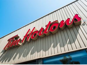 : An exterior view of a Tim Hortons Restaurant on August 26, 2014 in Oakville, Ontario, Canada.
