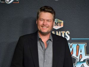 Blake Shelton Wrapped 'One Hell Of A Tour' - Blake wearing a black blazer and a gray shirt.