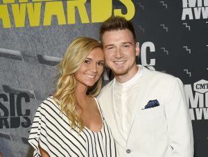 Morgan Wallen's Ex Spoke Out - Morgan in a white suit with his guest KT Smith wearing a black and white outfit.