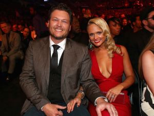 Five Country Music Couples We Adore - Blake in a suit and tie and Miranda in a red dress at the 2014 Grammy Awards in Los Angeles.