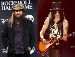 Chris Stapleton Rocks On Slash's New Album—Chris at the rock hall induction was wearing a back suit and cowboy hat, and Slash was wearing a hat on stage while playing the guitar.