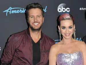 Luke Bryan 'Tight-Lipped' About Katy Perry - Luke in a brown jacket with Katy in a silver dress.