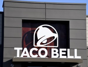 An exterior view shows a sign at a Taco Bell restaurant
