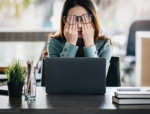 Concept Burnout Syndrome. Burnt-out Business Woman feels uncomfortable working. Which is caused by stress, accumulated from unsuccessful work And less resting body. Consult a specialist psychiatrist