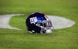 A New York Giants helmet sits on the field prior to the start of the game. Giants draft party sells out quickly.