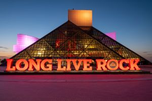 A general view of the Rock & Roll Hall Of Fame Lit in CARE Colors for International Day of The Girl at the Rock & Roll Hall of Fame and Museum on October 11, 2023 in Cleveland, Ohio.