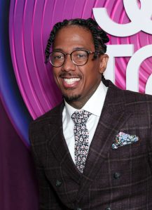 Nick Cannon attends Soul Train Awards 2023 smiling wearing a suit and glasses, Nick Cannon And Abby De La Rosa's Son Has Autism.