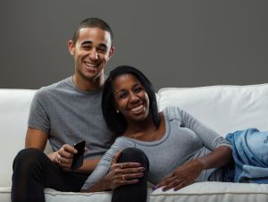 Couple resting on the couch.