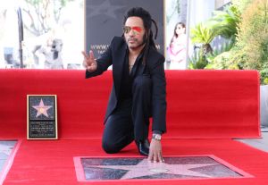 Lenny Kravitz getting his star on the Hollywood Walk Of Fame. Lenny Kravitz works out in leather pants.
