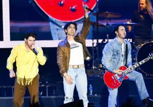 The Jonas Brothers perform onstage during the 2024 March Madness Music Festival, Jonas Brothers Spark Backlash After Cancelling Tour Dates.