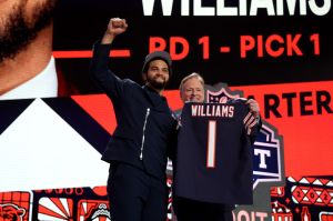 Caleb Williams poses with NFL Commissioner Roger Goodell after being selected first overall by the Chicago Bears during the first round of the 2024 NFL Draft. The NFC North