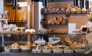 Buns, baguettes and other fresh bread at bakery display. Bakeries in Philadelphia are among the best.