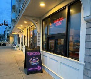 South Shore Taco Guy restaurant lit up at sundown