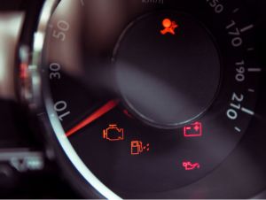 Many different car dashboard lights in closeup, car repairs concept.