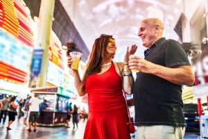 couple sightseeing in downtown las vegas streets at night enjoying one of the best food tours in the country.