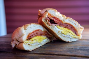 Taylor ham, pork roll, egg and cheese breakfast sandwich on a kaiser roll with salt pepper and ketchup from New Jersey a new breakfast spot in Tampa