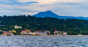 A view of Burlington, Vermont waterfront from a sail boat on Lake Champlain with Camel's Hump mountain in the background. New England vacation destination on the rise.