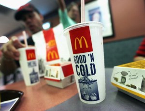 A customer eats with a 21 ounce cups of soda at a Manhattan McDonalds