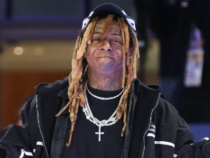 Team Stephen A. Coach Lil Wayne poses for a photo during the first half against Team Shannon during the Ruffles NBA All-Star Celebrity Game, Lil Wayne's Son Names Who He Thinks Is The 'New Lil Wayne'.