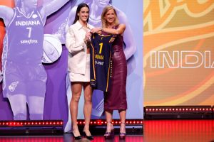 Caitlin Clark poses with WNBA Commissioner Cathy Engelbert after being selected first overall pick by the Indiana Fever. The WNBA season starts May 14.