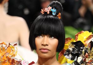 Nicki Minaj attends The 2024 Met Gala Celebrating "Sleeping Beauties: Reawakening Fashion", Nicki Minaj Threatens To Fire Tour DJ For Signing Boobs After Arrest.