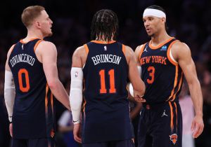 Donte DiVincenzo #0, Jalen Brunson #11 and Josh Hart #3 of the New York Knicks celebrate their win against the Indiana Pacers