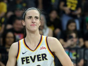 Caitlin Clark #22 of the Indiana Fever looks on during player introductions before a game against the Las Vegas Aces at Michelob ULTRA Arena. People are often curious about what Caitlin Clark eats for breakfast, lunch and dinner.
