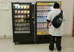 Person looking at a vending machine. Airheads will be selling an Underwater Vending Machine!