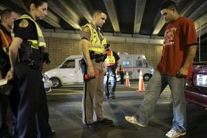 A person getting a road side test. A man who was pulled over gave a fake I.D. saying he was 8 feet tall.