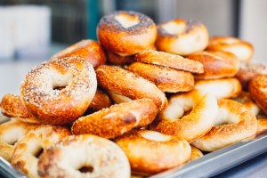Bread bagels freshly baked in a commercial kitchen at a New England bagel chain.