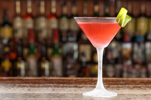 An alcoholic cosmopolitan cocktail is on the bar. A Garden State New Jersey martini