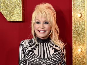 Dolly Parton Knows The Devotion Of Her Fans - Dolly in black and gold.