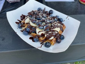 Food at Boston Calling a waffle with blueberries, bananas and chocolate in a dish.
