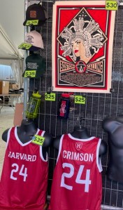 Boston Calling merch the hat collection, poster and Harvard jersey.