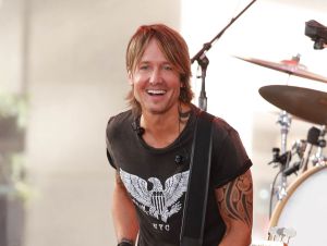 Keith Urban's Vegas Crowd Debate  - Keith on stage in a black t-shirt.