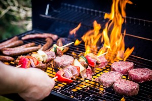 Detail Of Beef Burgers and sausages Cooking On A Barbecue. Grilling in Fort Myers.
