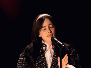 Billie Eilish performs onstage during the 96th Annual Academy Awards singing with her eyes closed, Billie Eilish Lost All Her Friends At 14 After Fame.