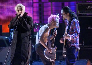 Anthony Kiedis, Flea and John Frusciante of the Red Hot Chili Peppers performing on stage in 1999 at the Billboard Music Awards.