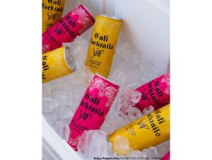 19 Crimes Cali Cocktails in bright yellow and pink cans on ice.